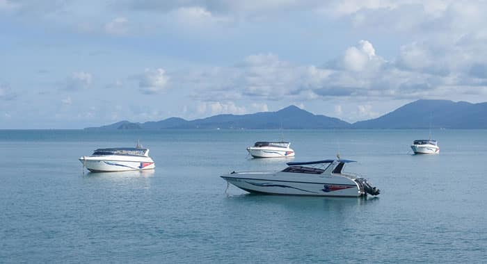 4 Lomprayah Speedboats anchored with islands in background
