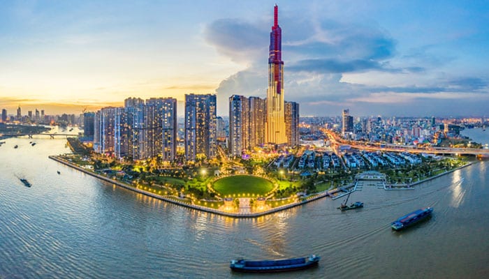 Top view aerial of center Ho Chi Minh City and Saigon bridge with development buildings, transportation, energy power infrastructure. Financial and business centers in  Vietnam. View from District 2