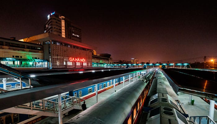 Trains are stationed while waiting for passengers to board at Hanoi Railway Station. Night landscape with many trains