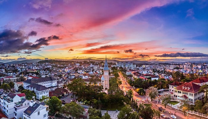 Chicken church in Da Lat city. Beautiful sunset sky view over Dalat from above