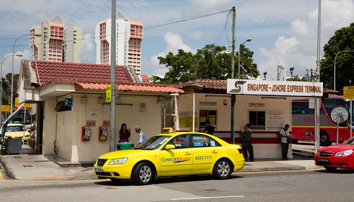 Queen Street Bus Terminal in Singapore. From this terminal travelers can take taxis and buses to Johor Bahru, Malaysia.