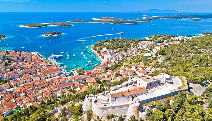 Hvar and Fortica fortress aerial view from high point with ocean background